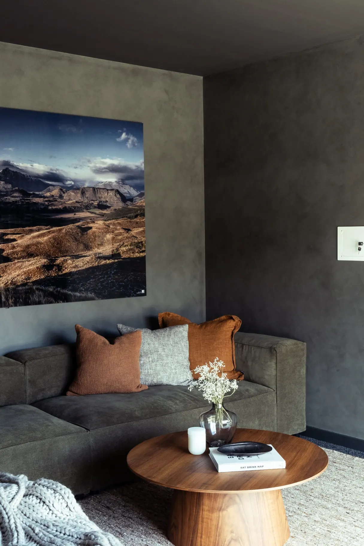 Completed Drysdale Road lounge with textured walls and timber table, Queenstown