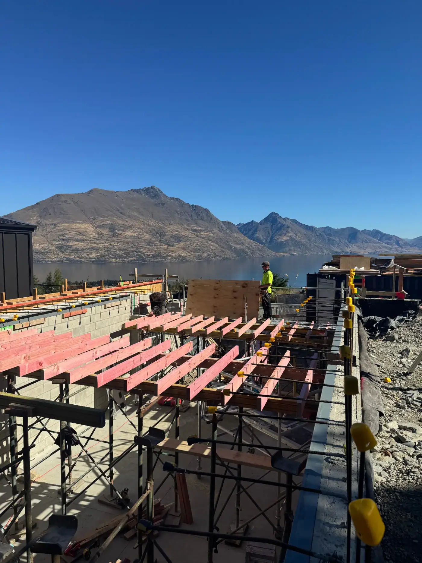 Floor joists in place at the Vancouver Drive home build with lake and mountain views, Queenstown