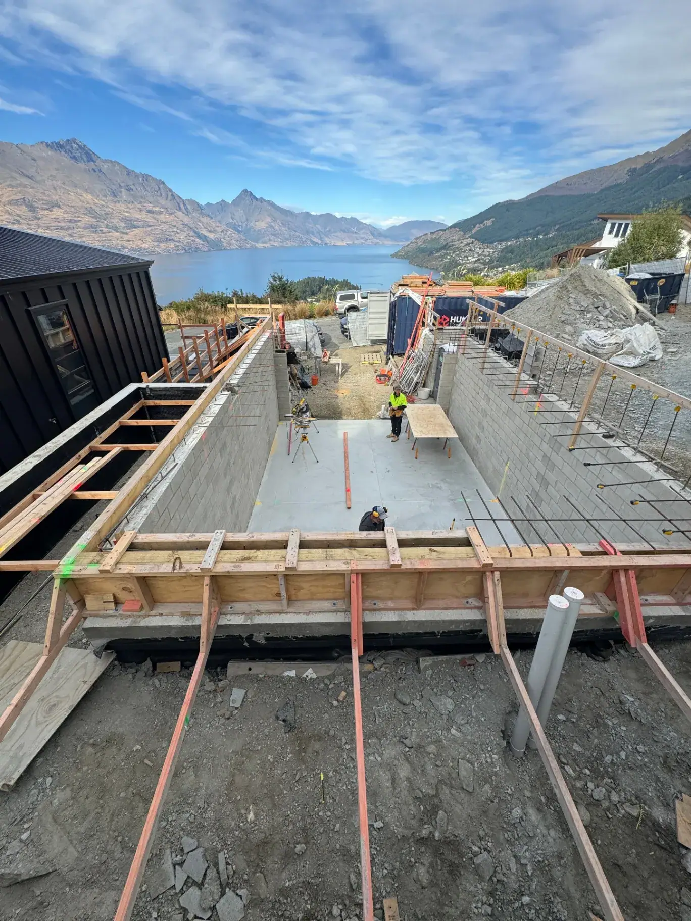Foundations and blockwork underway at the Vancouver Drive home build with lake views, Queenstown